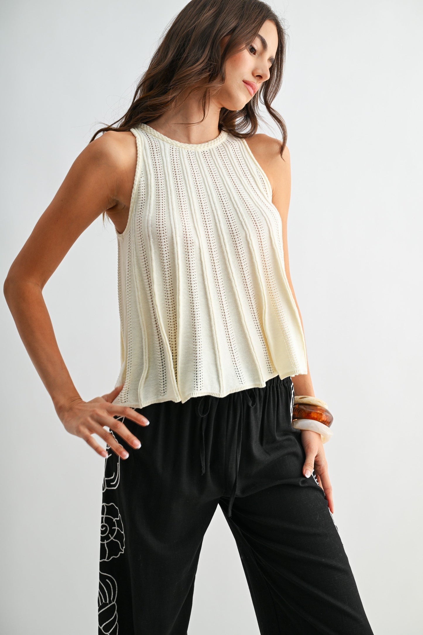 Sleeveless Knit Top With Flared Hem